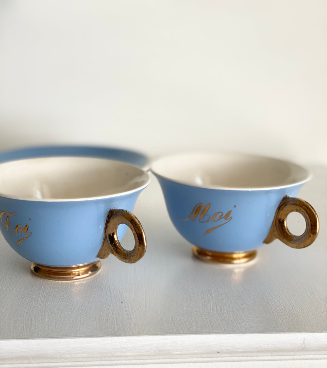 antique french "toi et moi" gold and cerulean teacups and saucers