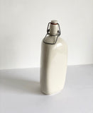 vintage French stoneware bottle, triangular with porcelain lid