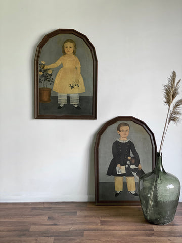 pair of framed vintage primitive folk art prints