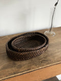 pair of vintage low-profile woven baskets
