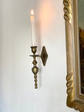 pair of brass torch candle sconces