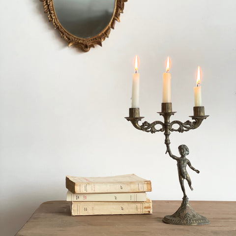 French cherub cast candle holder