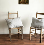 pair of vintage French ticking pillows