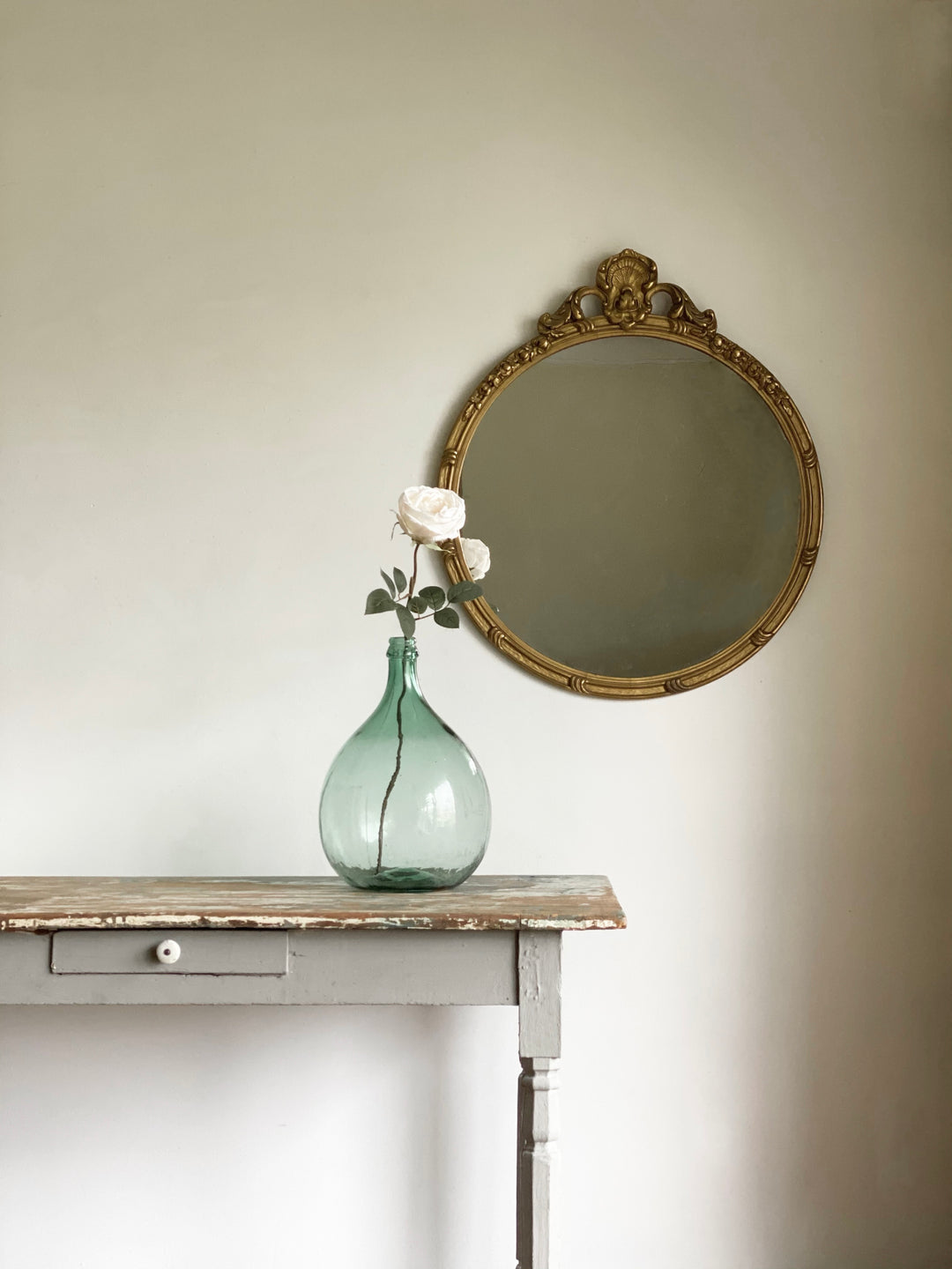 antique round gilded mirror