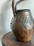 vintage hand forged metal vessel
