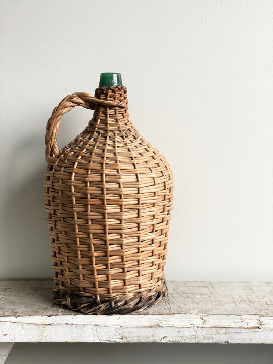 vintage French wicker wrapped demijohn
