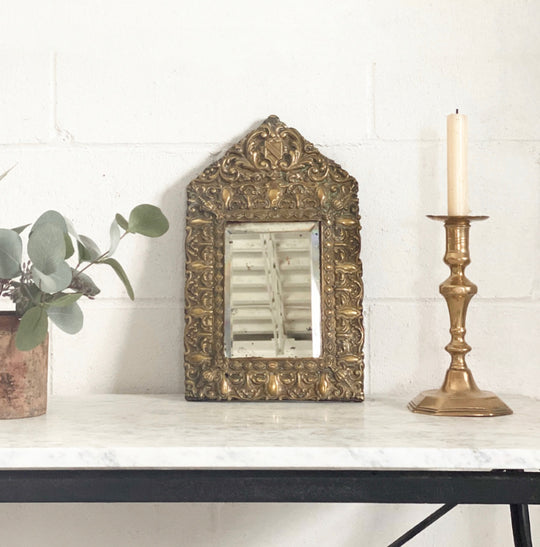 antique French petite repousse mirror with beveled glass