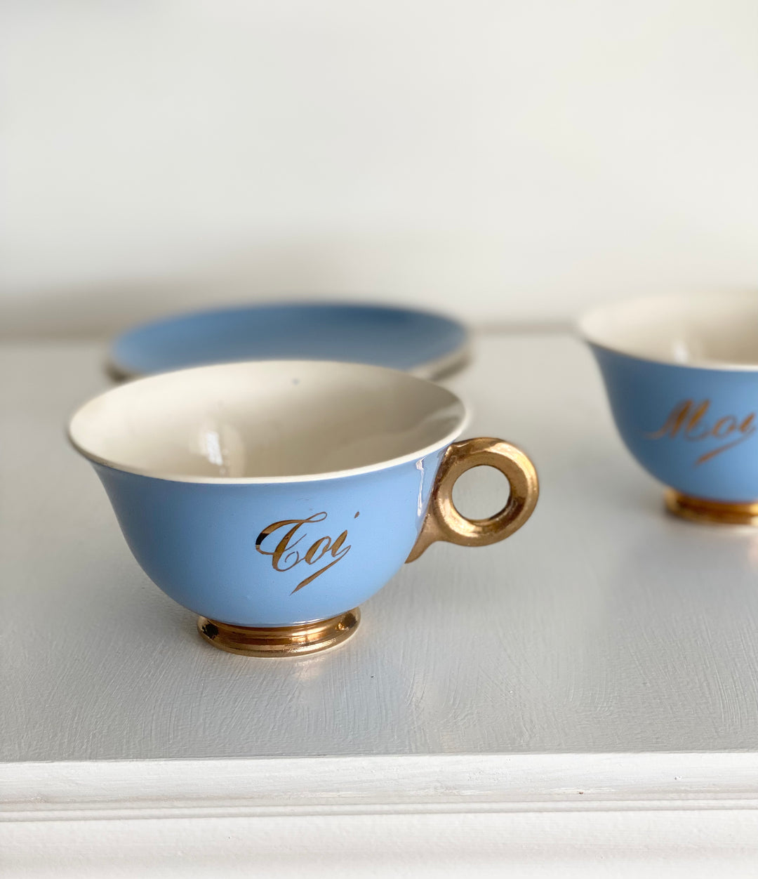 antique french "toi et moi" gold and cerulean teacups and saucers
