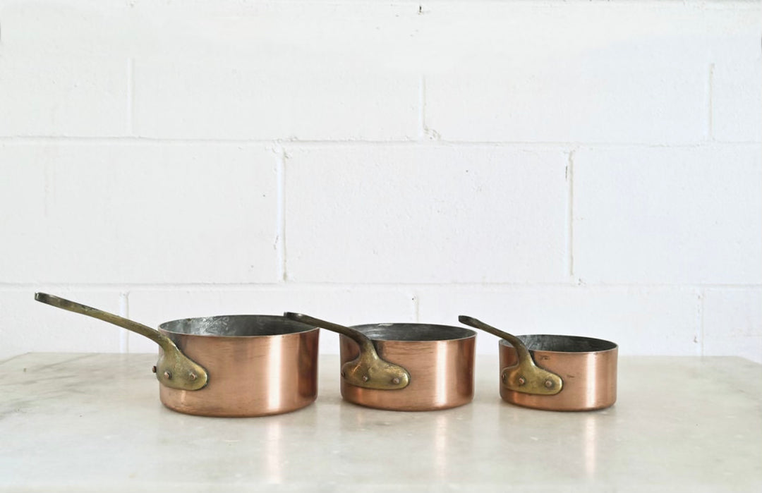 vintage French copper stamped sauciers, graduated set of 3